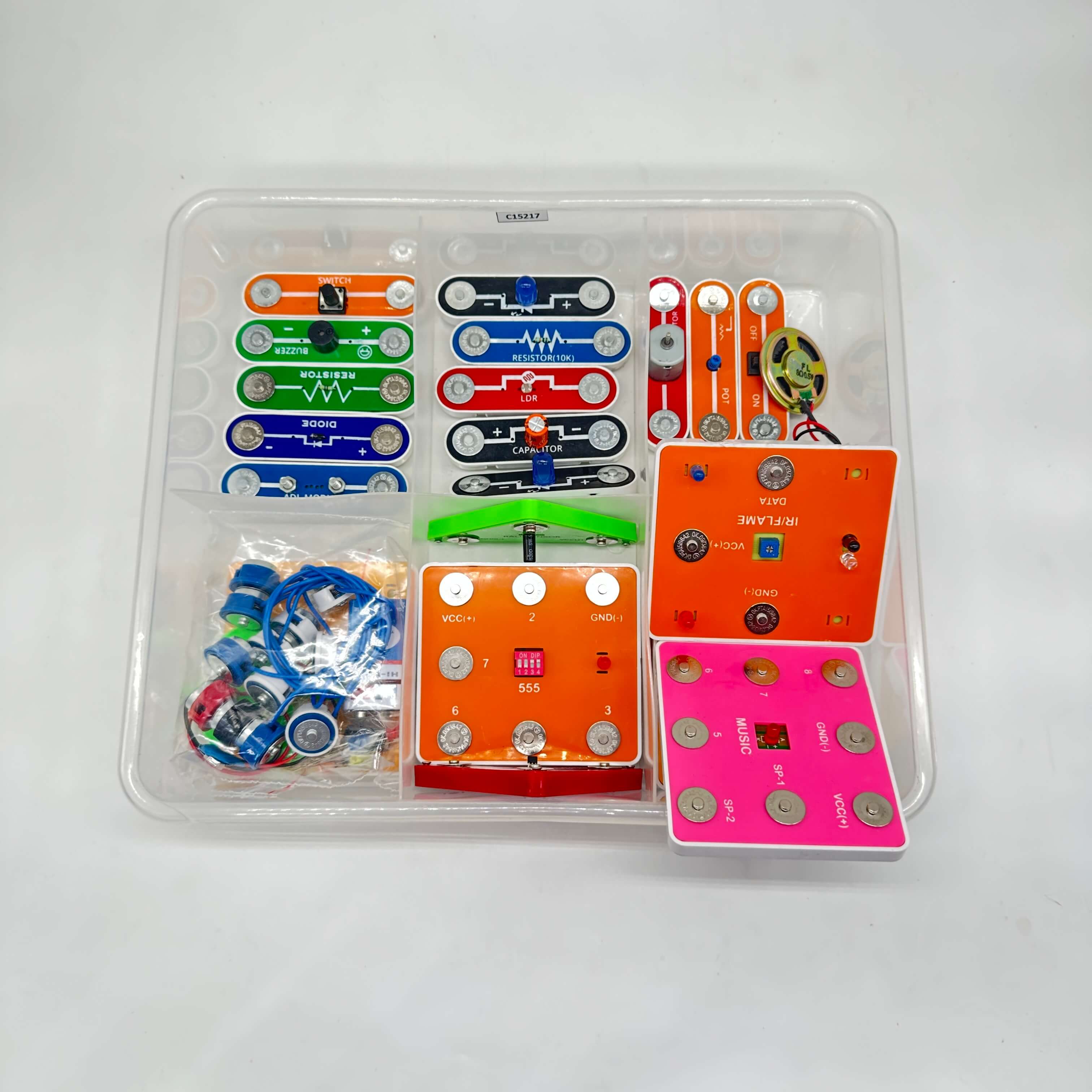 Colorful electronic circuit boards in a clear plastic case on a white background