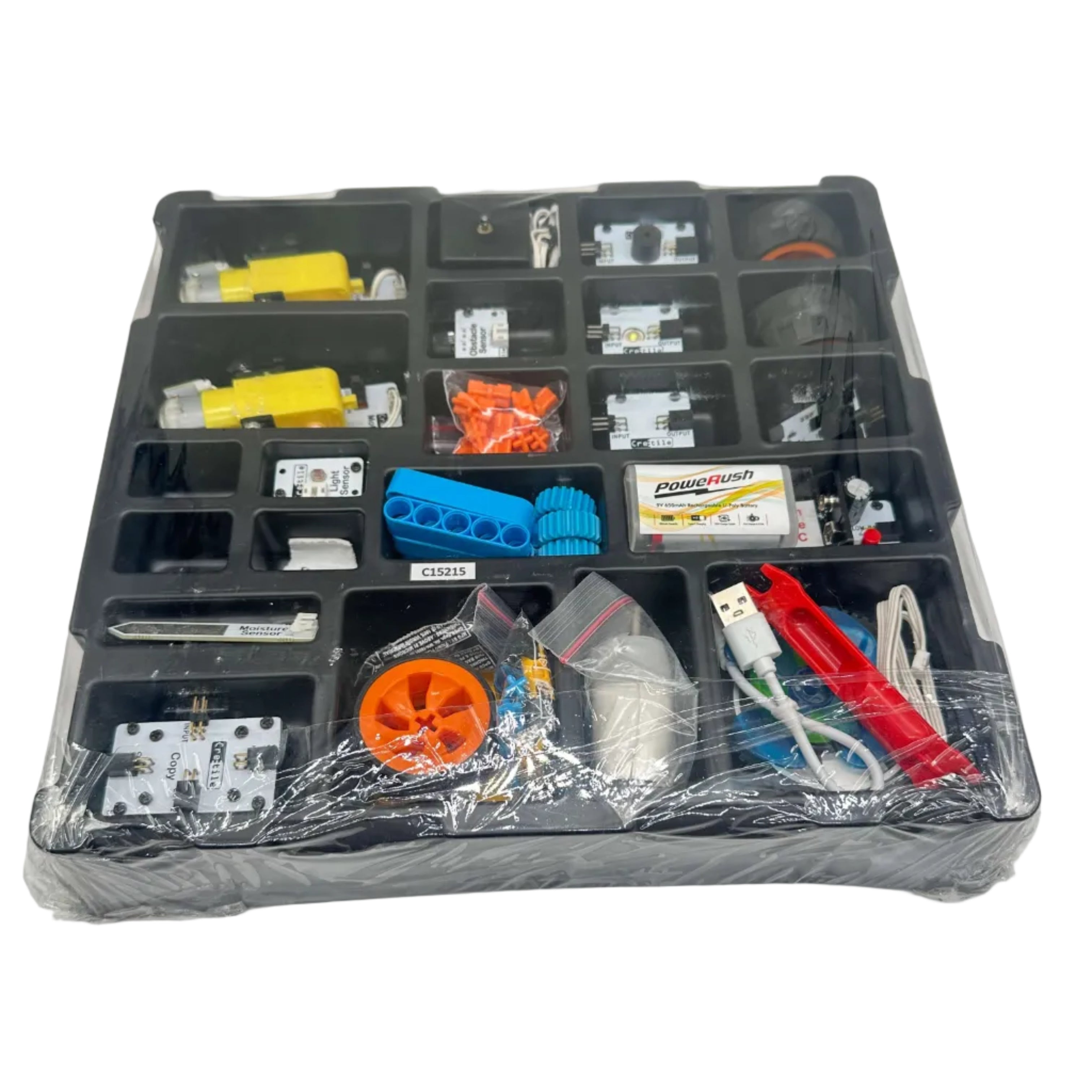 Assorted electronic components in a clear plastic case on a white background