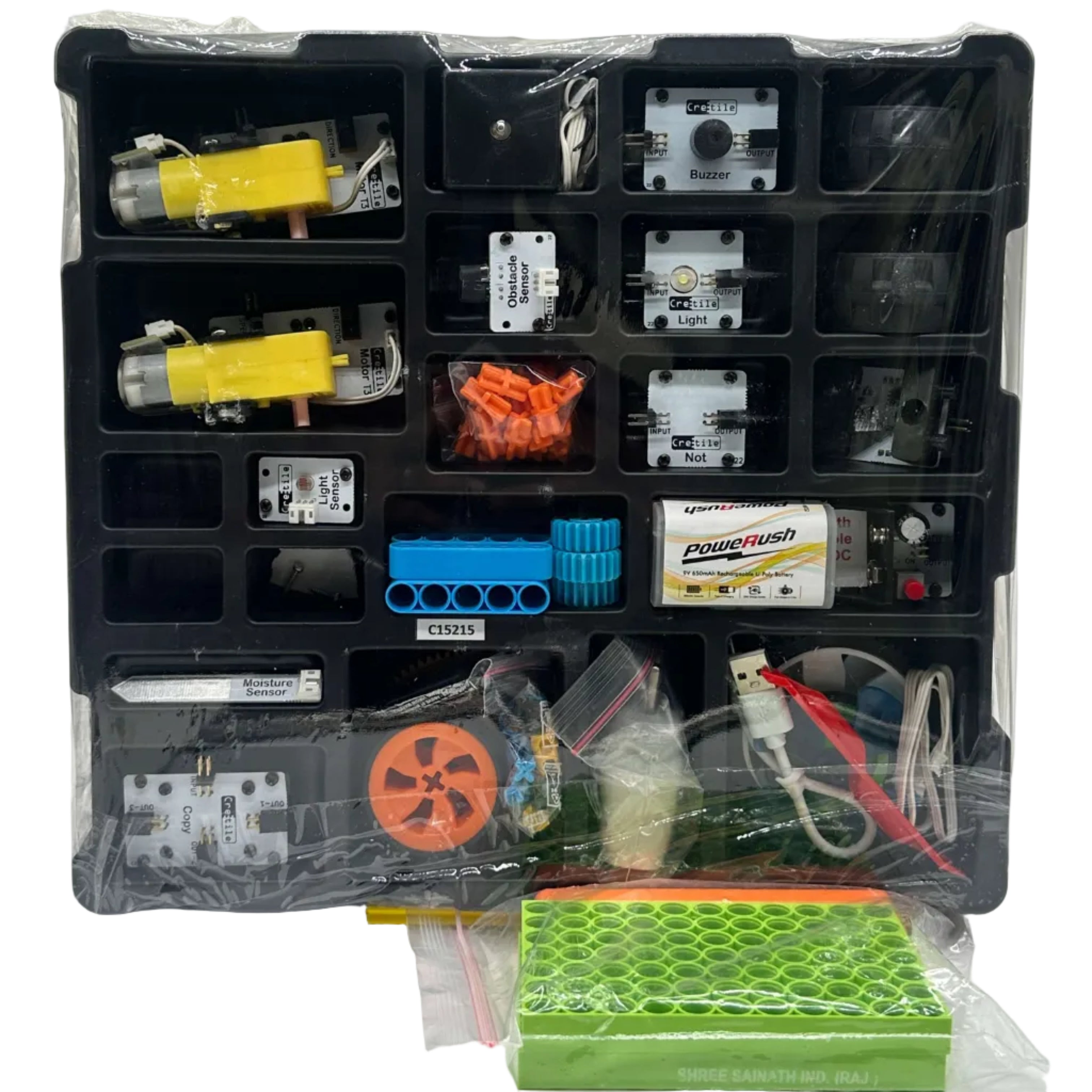 Assorted electronic components in a clear plastic organizer on a white background