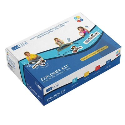A boxed Cretile Explorer Kit product package photographed on a light blue studio background. The box is predominantly white and blue with printed product imagery, text, and small colored icons.