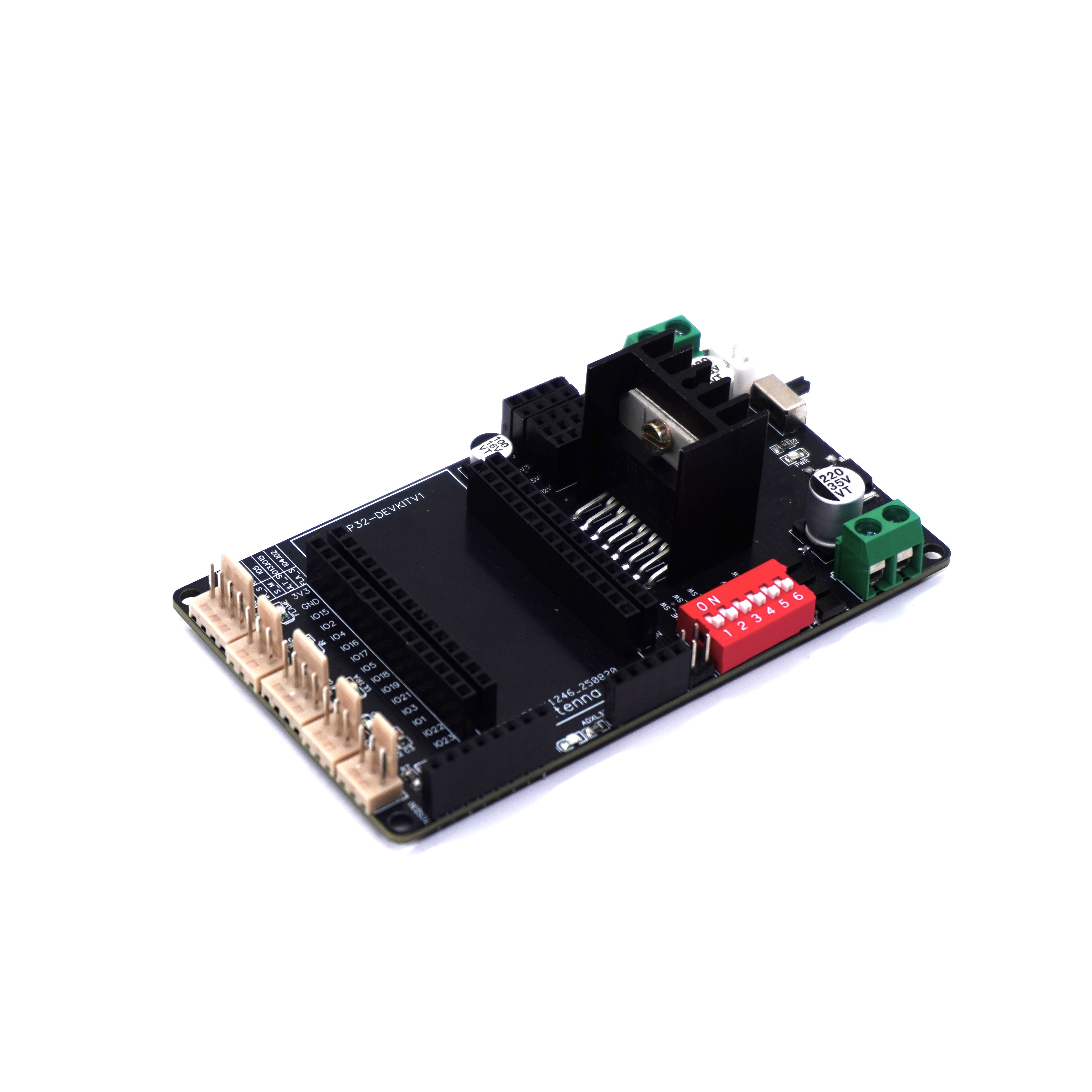 An angled view of a black ESP32 carrier board, showing the L298N motor driver, red DIP switch, green screw terminals, and multiple sensor headers