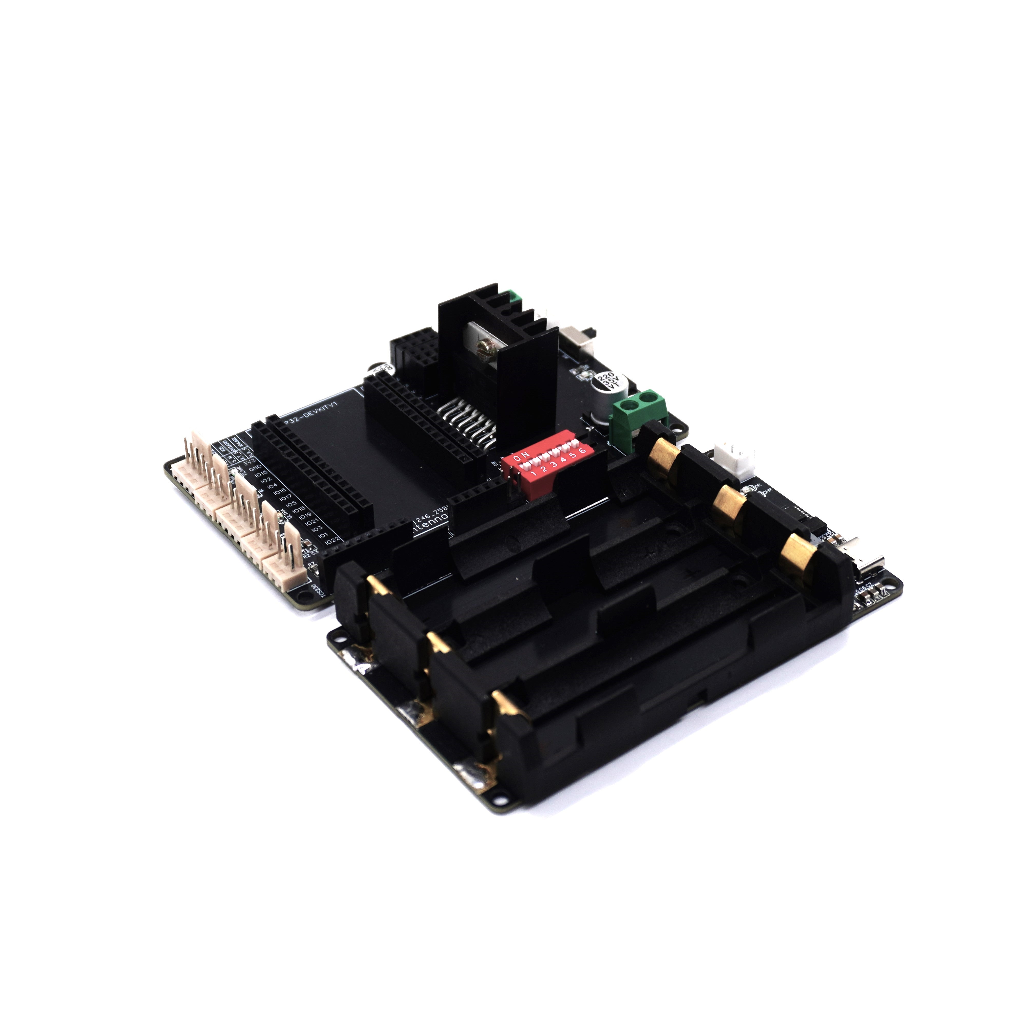 An angled view of a black ESP32 carrier board with its detached 3-cell 18650 battery holder, shown on a white background