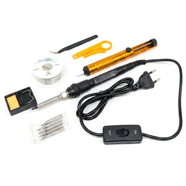 A soldering kit with a black soldering iron, orange temperature gun, black solder stand, spool of solder, solder tips, tweezers, and a switch on a white background.