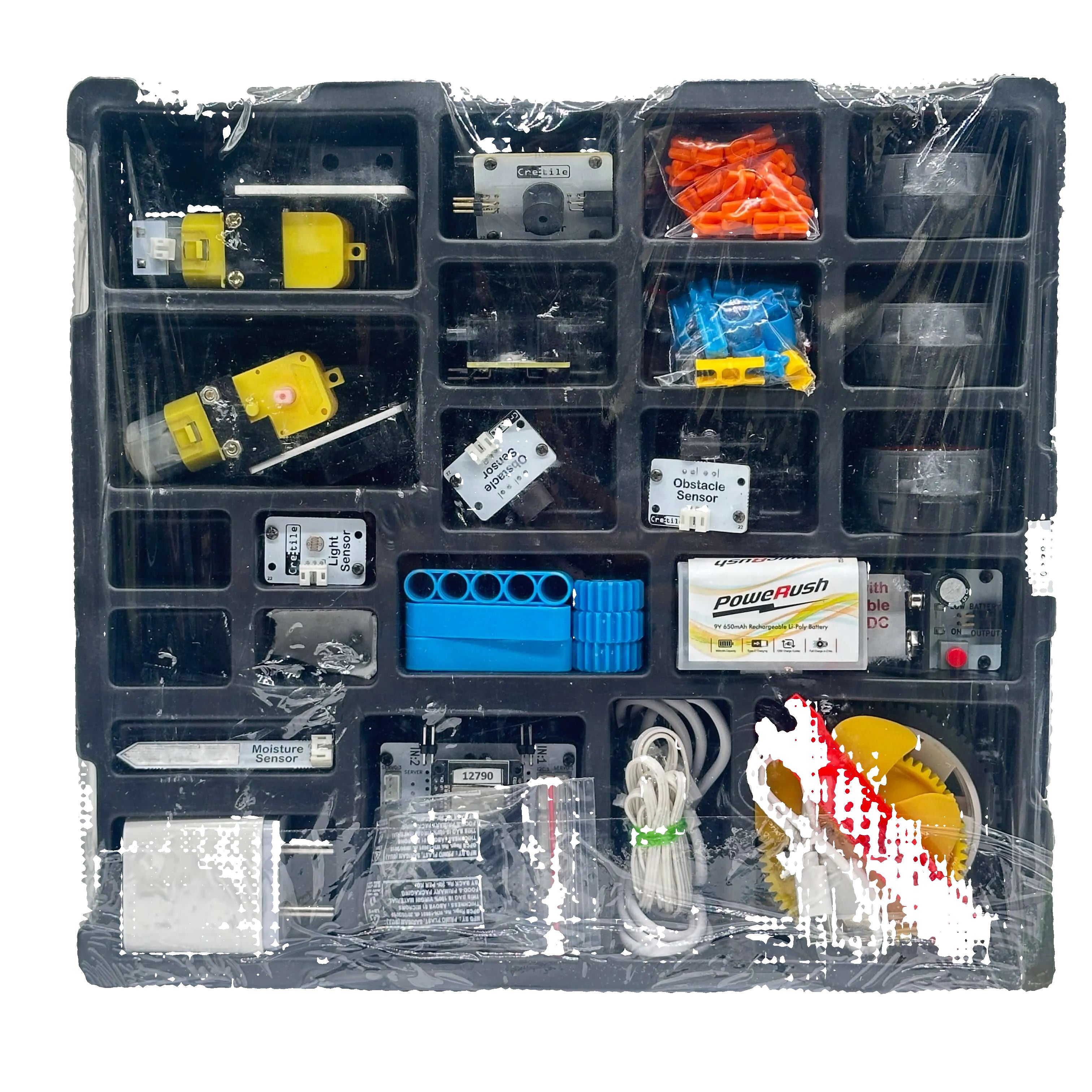 Assorted electronic components in a clear plastic case on a white background